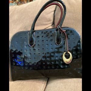 Arcadia Italian black patten leather satchel with red trim.